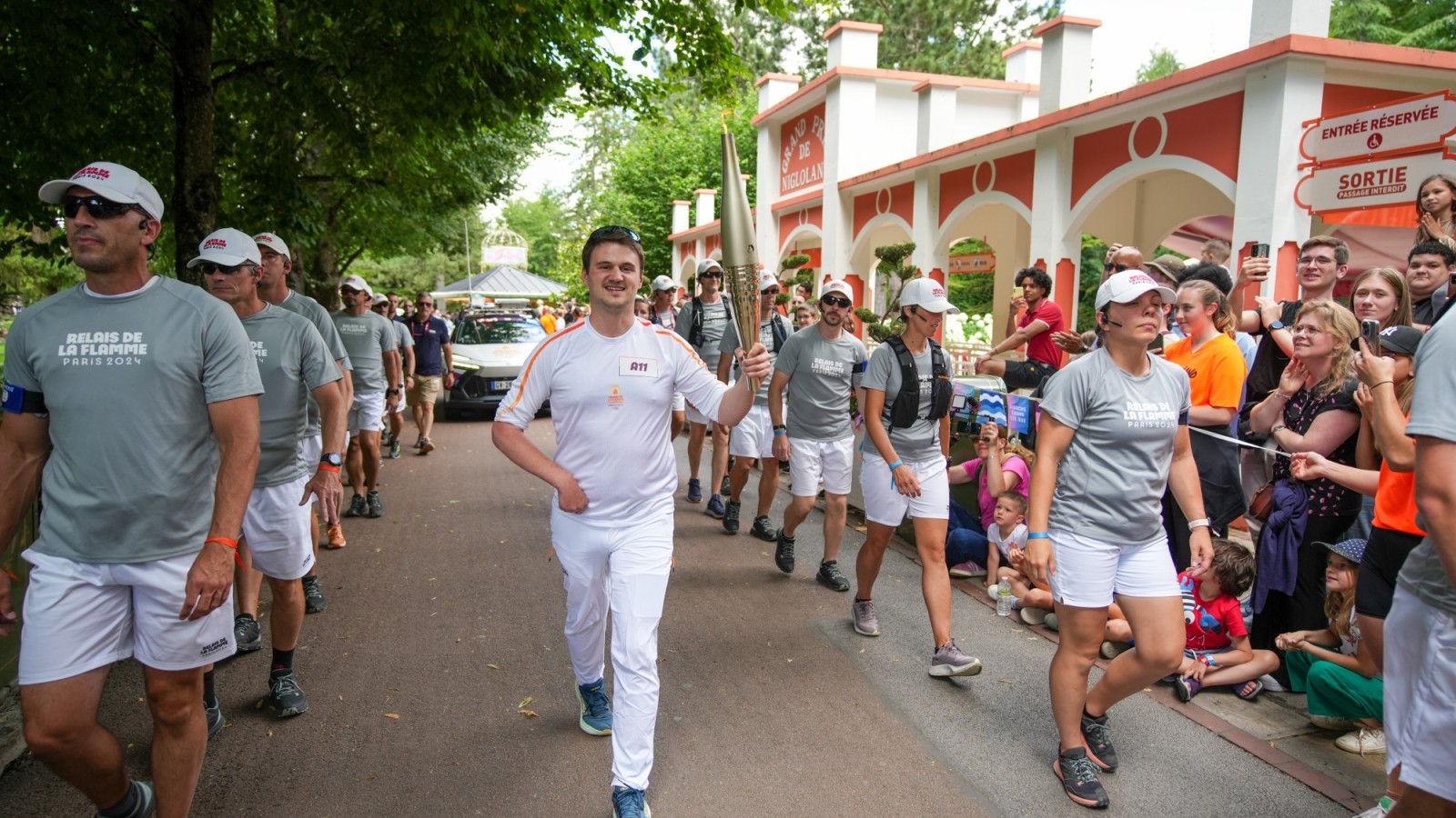 Louis Gustin carrying the Olympic Torch